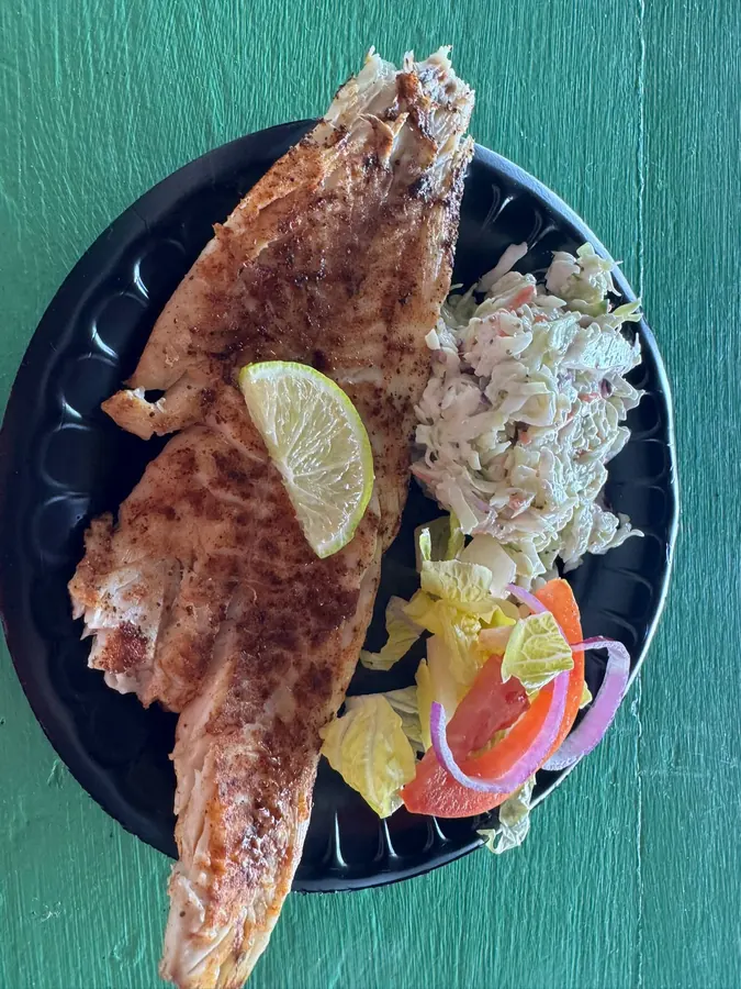 A fish plate with slaw