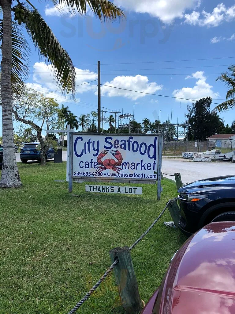 The City Seafood cafe and market roadside sign